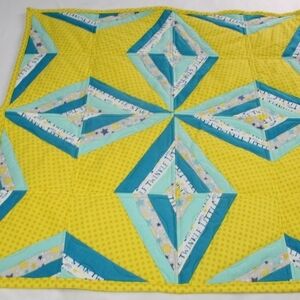 Homemade Star and Diamond quilt for baby.